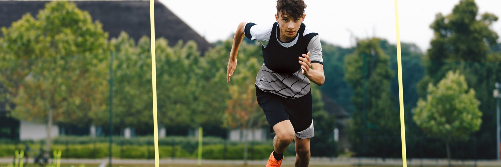 Young person running on a football pitch