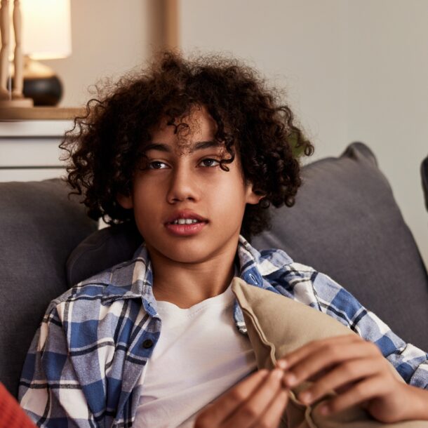 Boy sat on the sofa