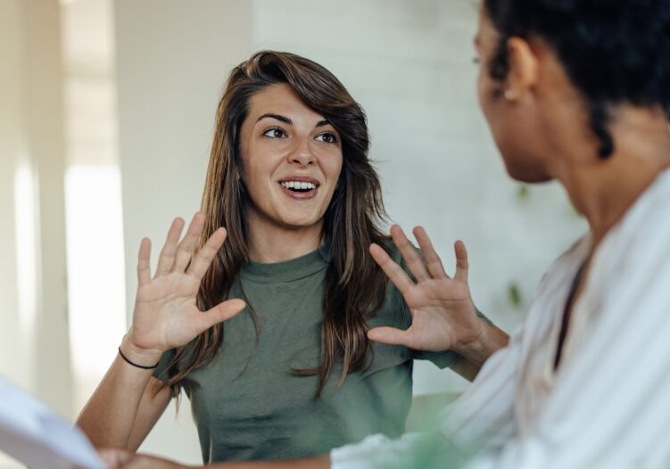 Two staff members talking