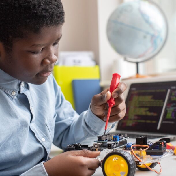 Boy building a robot in a Science lesson