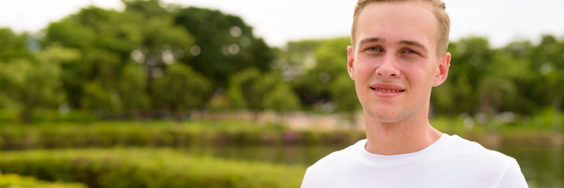 Portrait of young teenage boy at the park