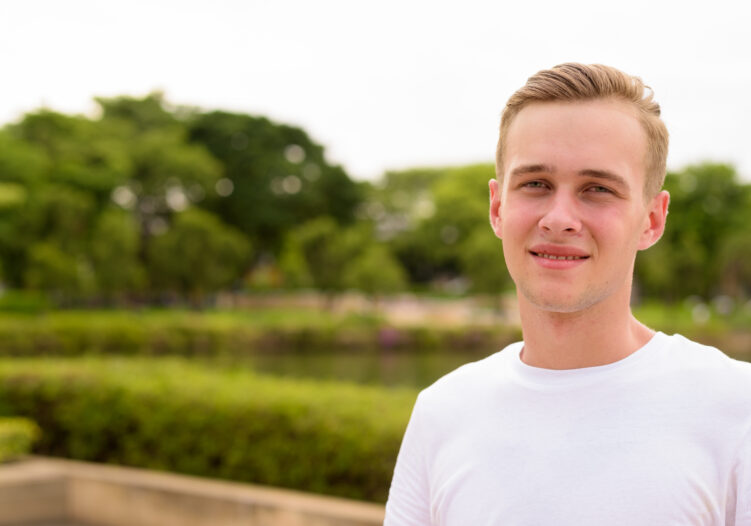 Portrait of young teenage boy at the park