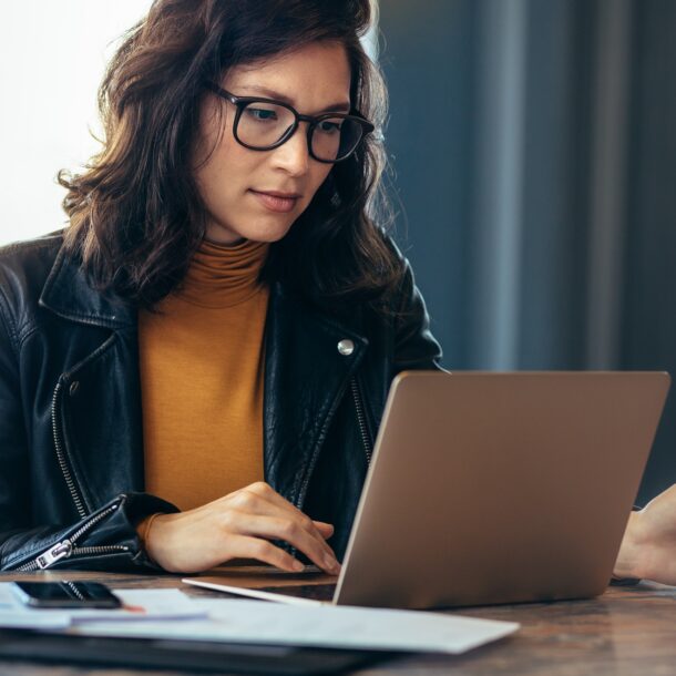 Professional using a laptop